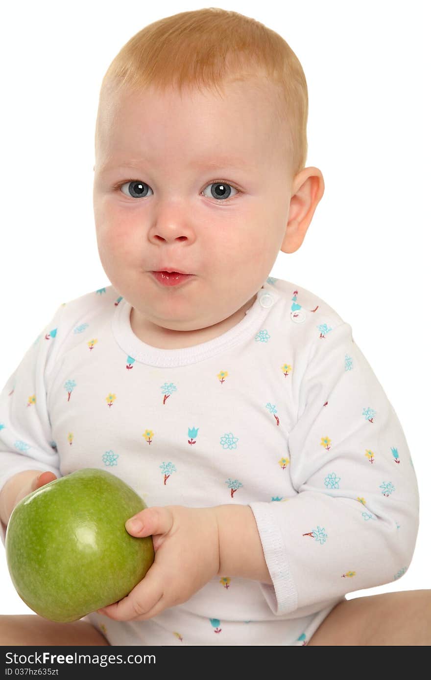 Beautiful baby with a green apple.