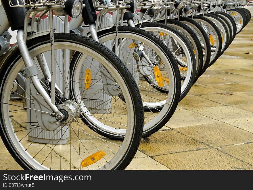 Parked bicycles, focusing on wheels. Parked bicycles, focusing on wheels.