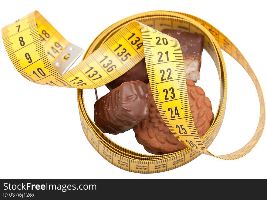 Centimeter with sweets and cookies close up on a white background