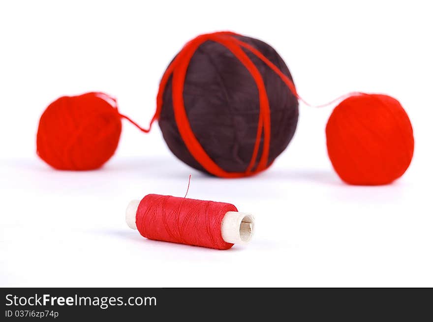 Red and brown balls on a white background