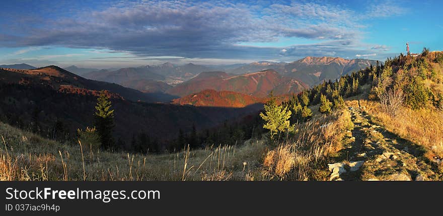 The mountain autumn landscape with colorful forest