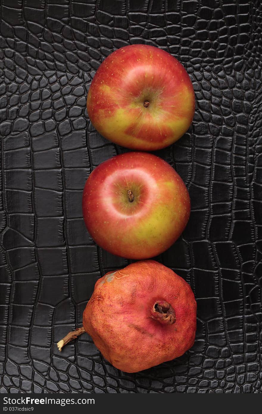 Three red apples