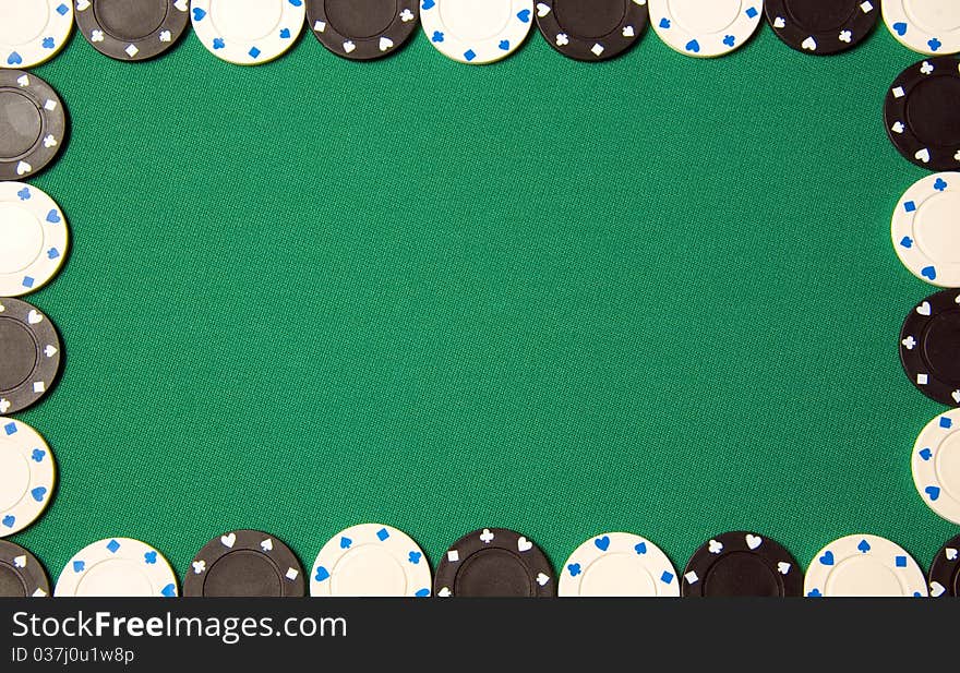 Green poker background with gambling chips all around