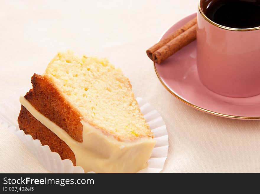 Peace of easter cake and espresso coffee cup with cinnamon stick