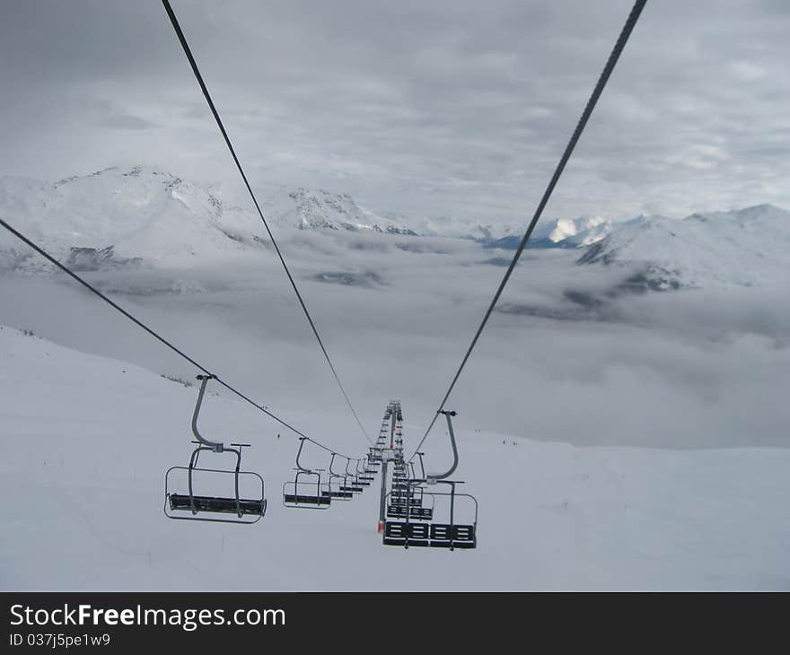 Chair lift and mountains