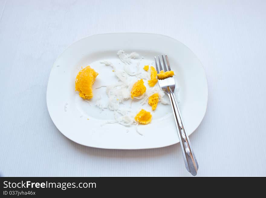 Dessert thai sweet sugar palm cake with coconut  On a white plate