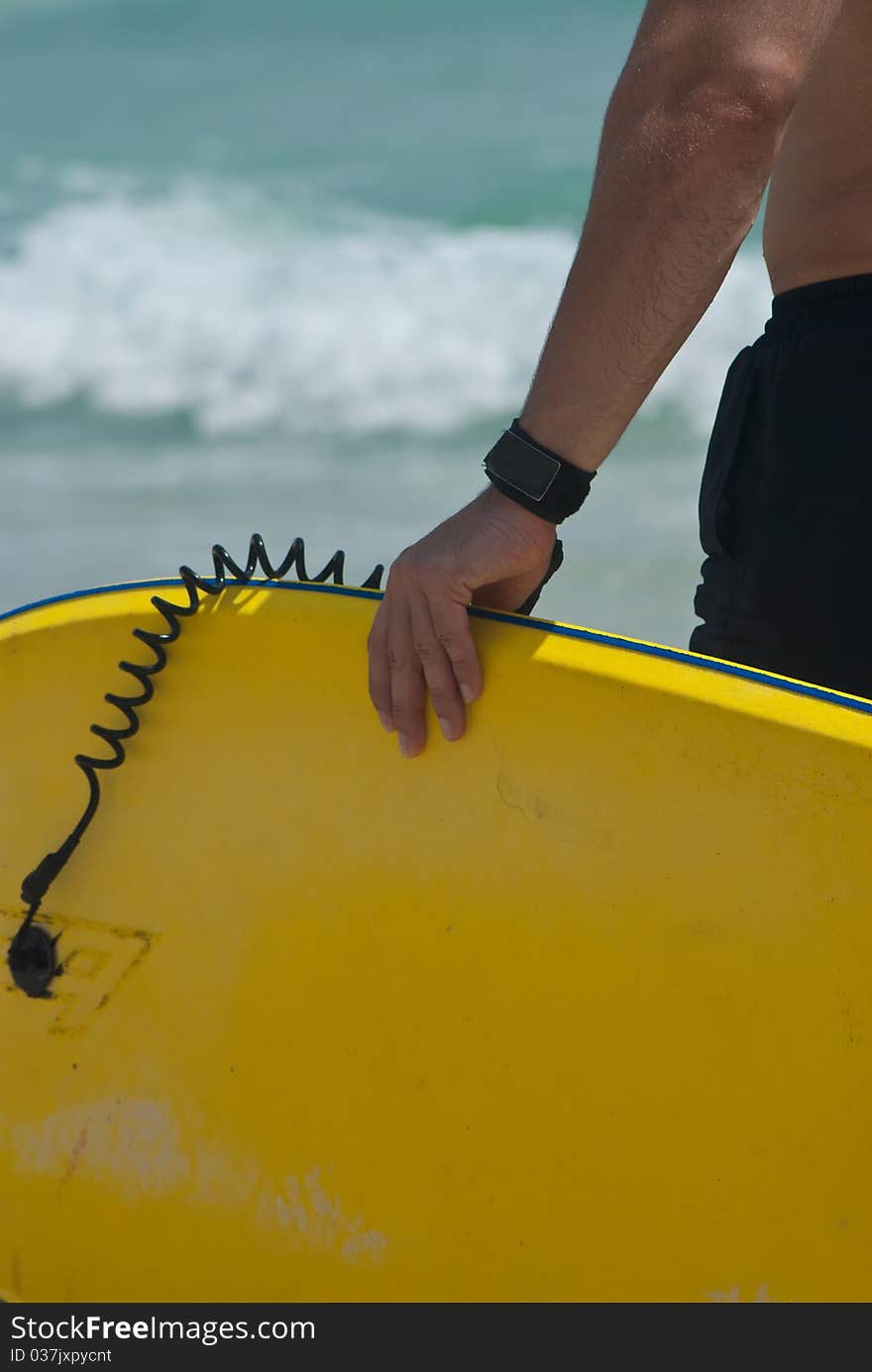 Male surfer awaitng to play