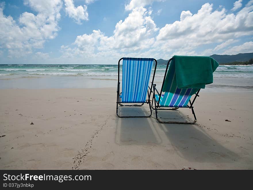 Two beach chairs on the beach. Two beach chairs on the beach.