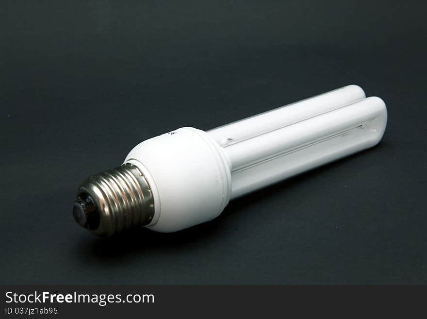 Isolated light bulb on gray