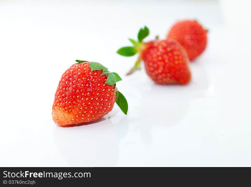 Beautiful strawberries isolated on white, a close-up