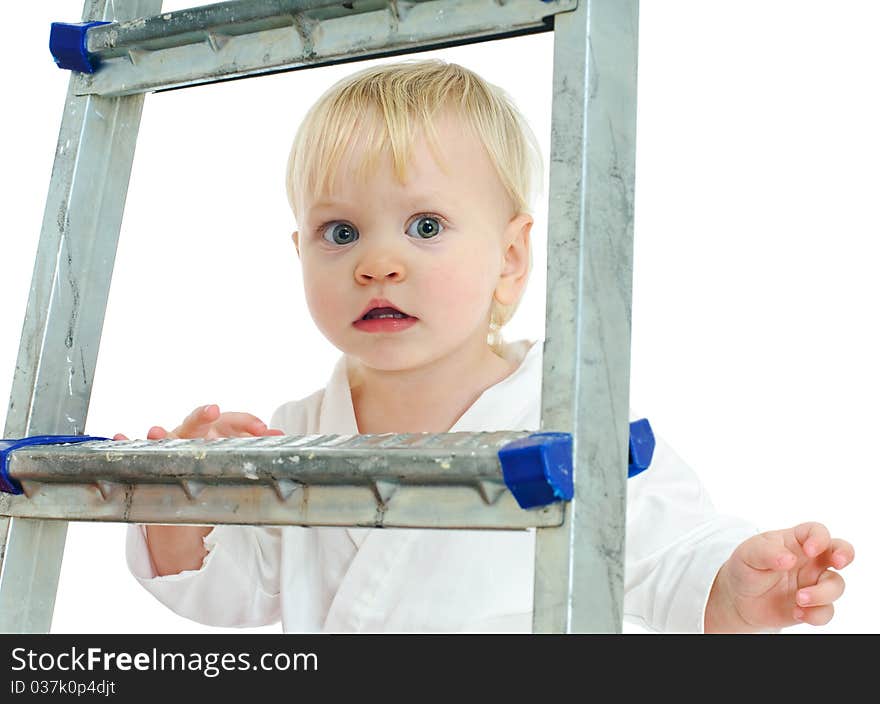 Little boy in kimono on step ladder and white background