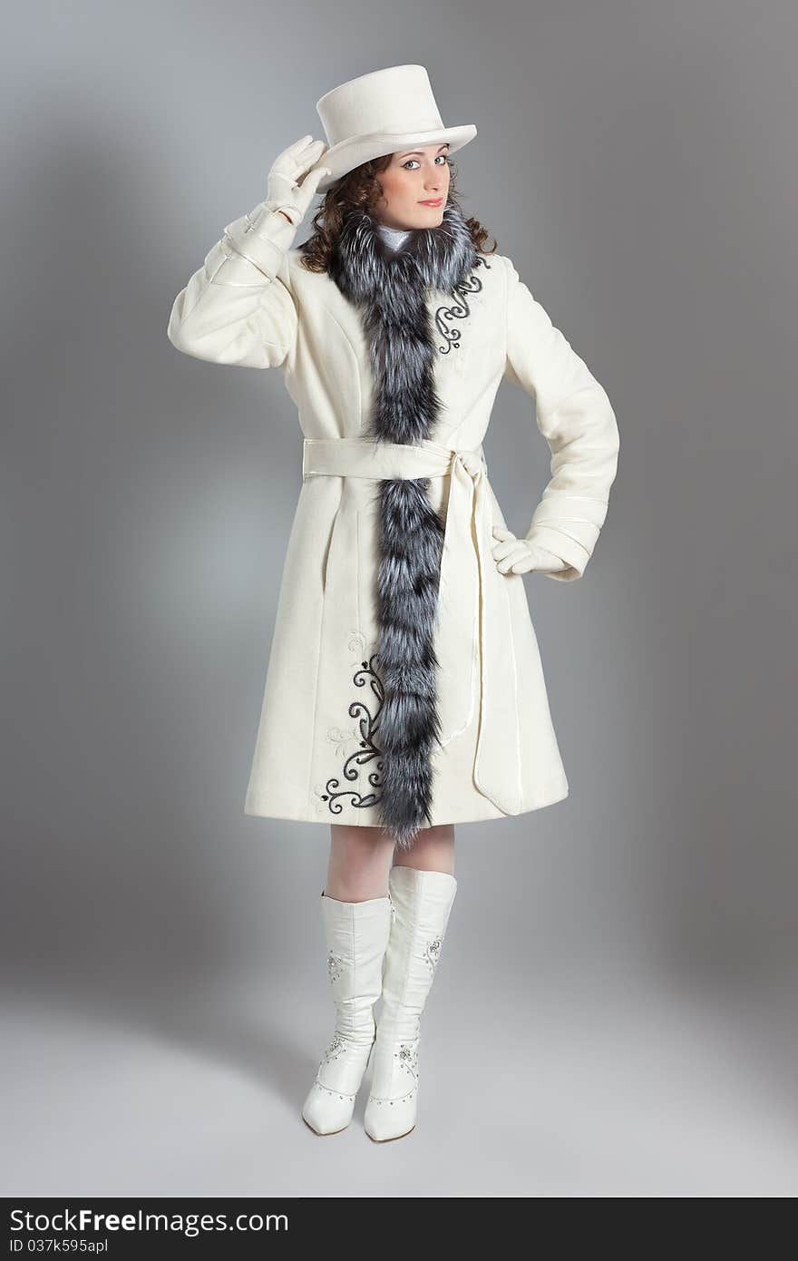 Girl in fur coat posing