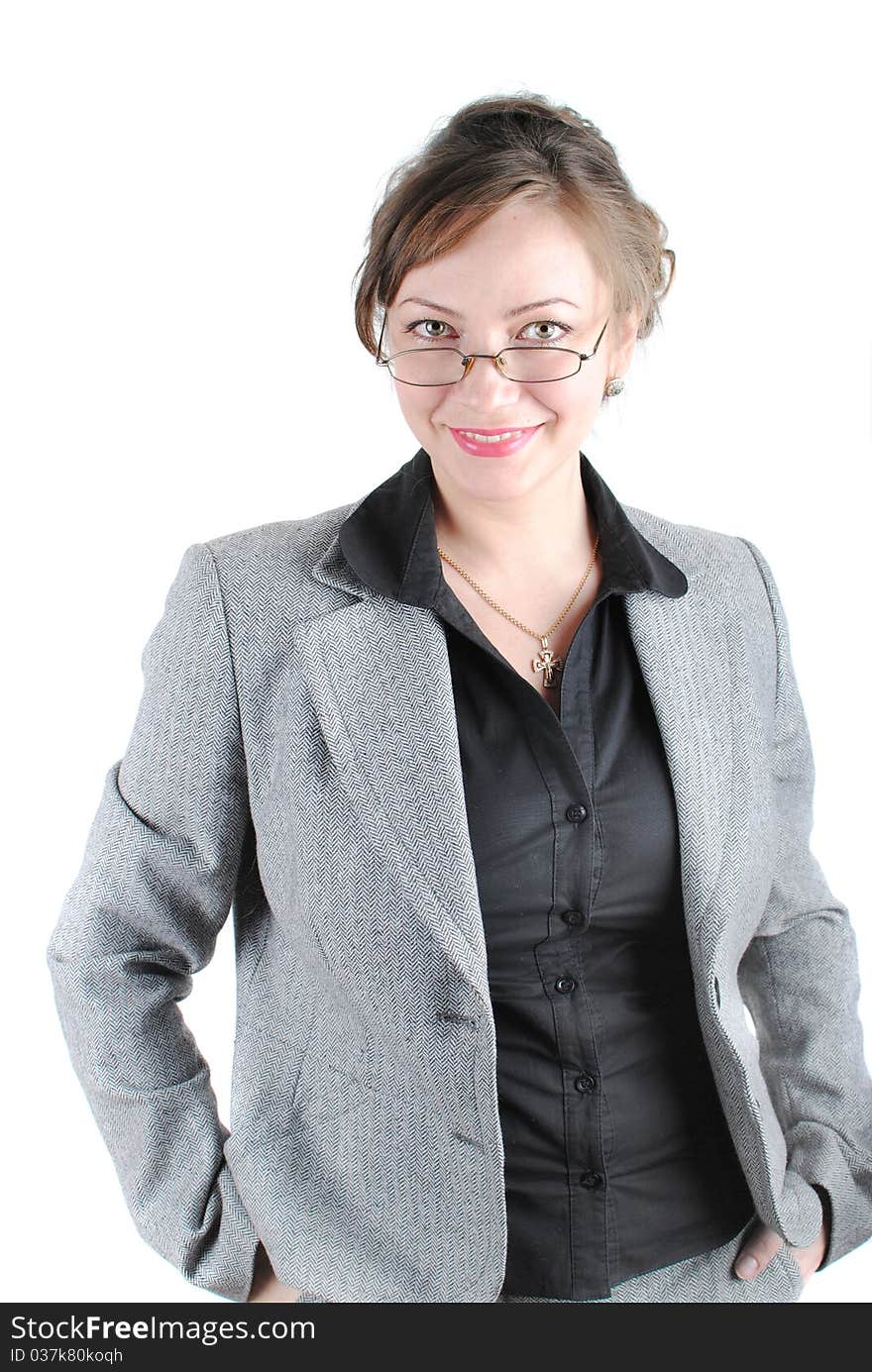 Beautiful young woman posing in business suit and glasses. Isolated over white background.