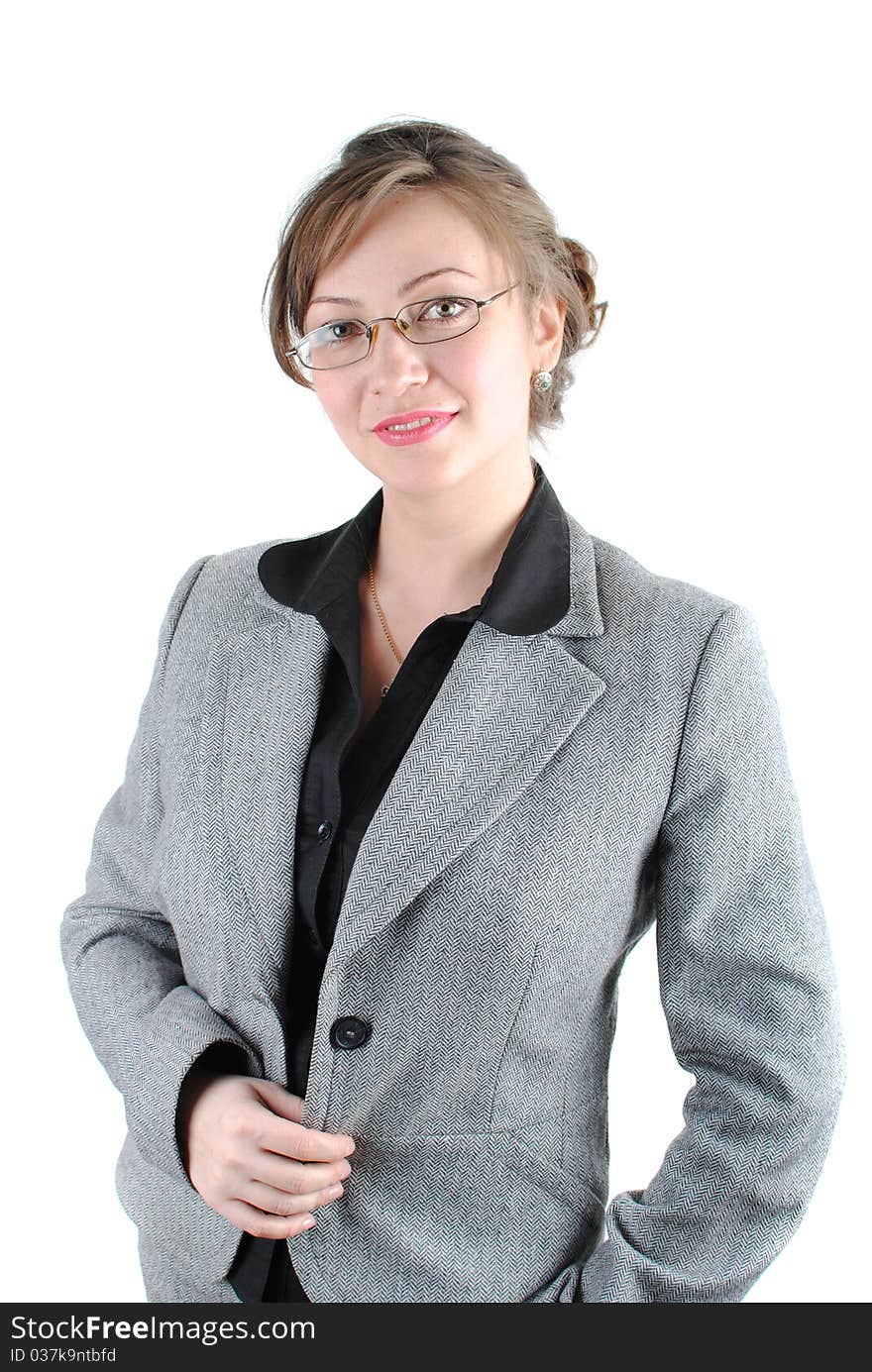 Beautiful young woman posing in business suit and glasses. Isolated over white background.