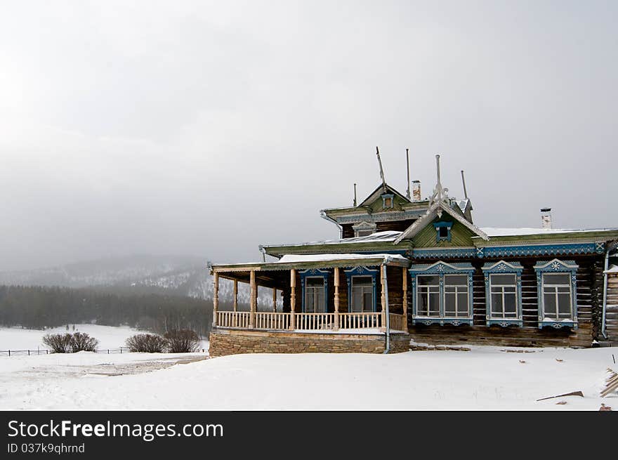 Winter scene in mountains. Old house and snow. Winter scene in mountains. Old house and snow