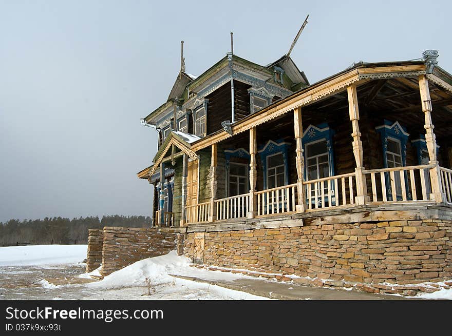 Winter scene in mountains. Old house and snow. Winter scene in mountains. Old house and snow