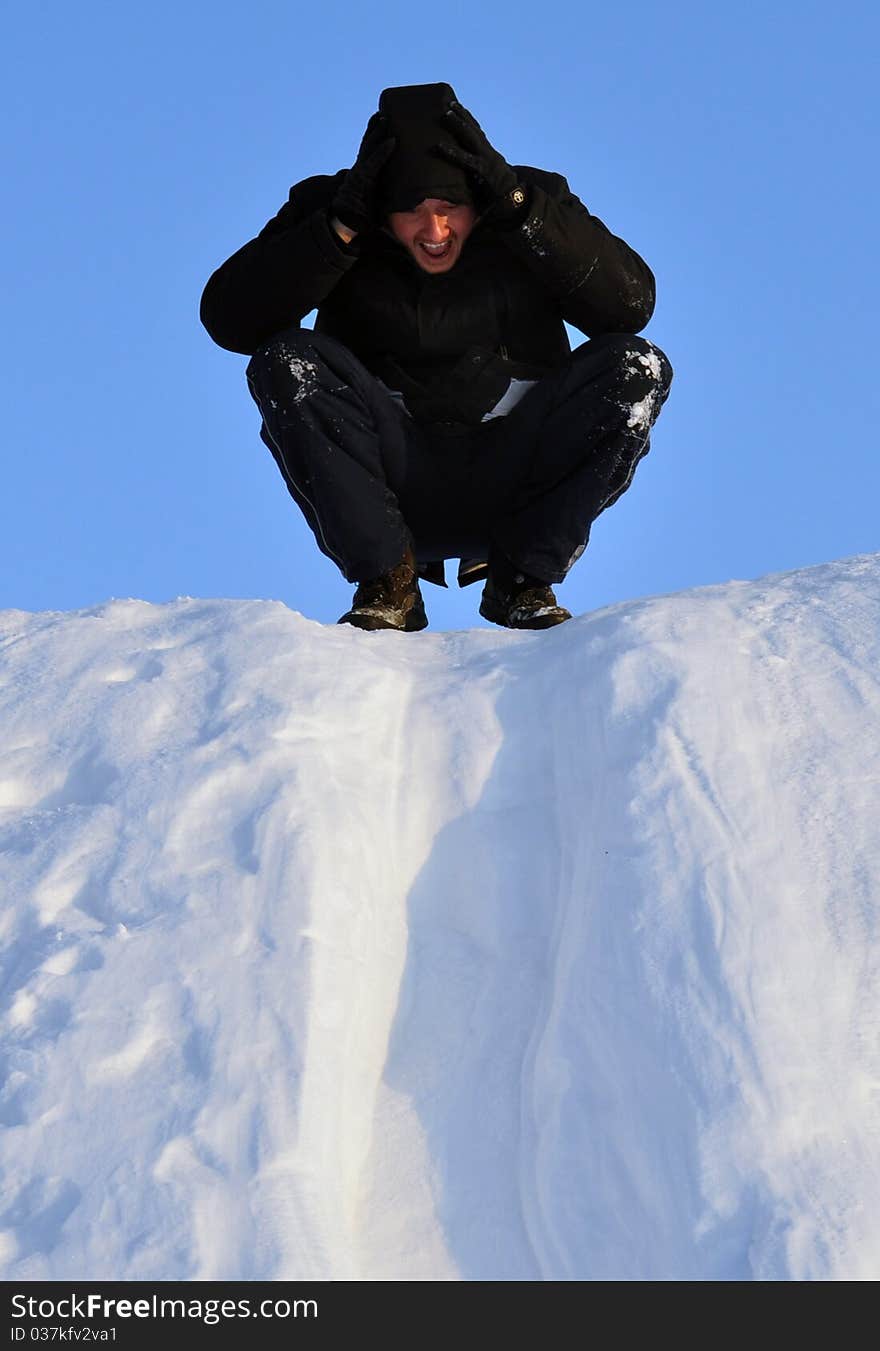 Man sliding at snow slideway