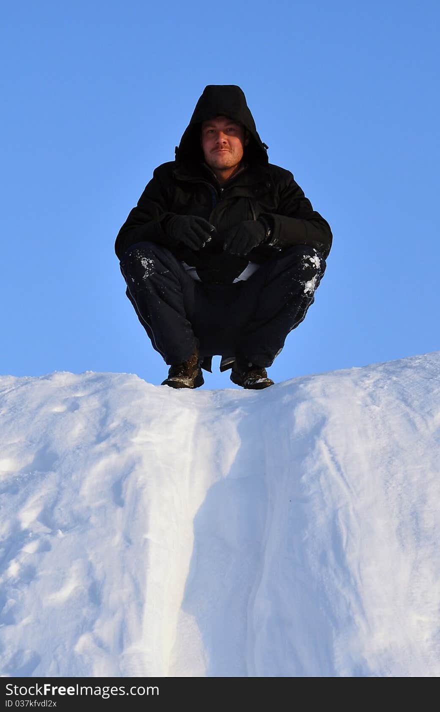 Man sliding at snow slideway