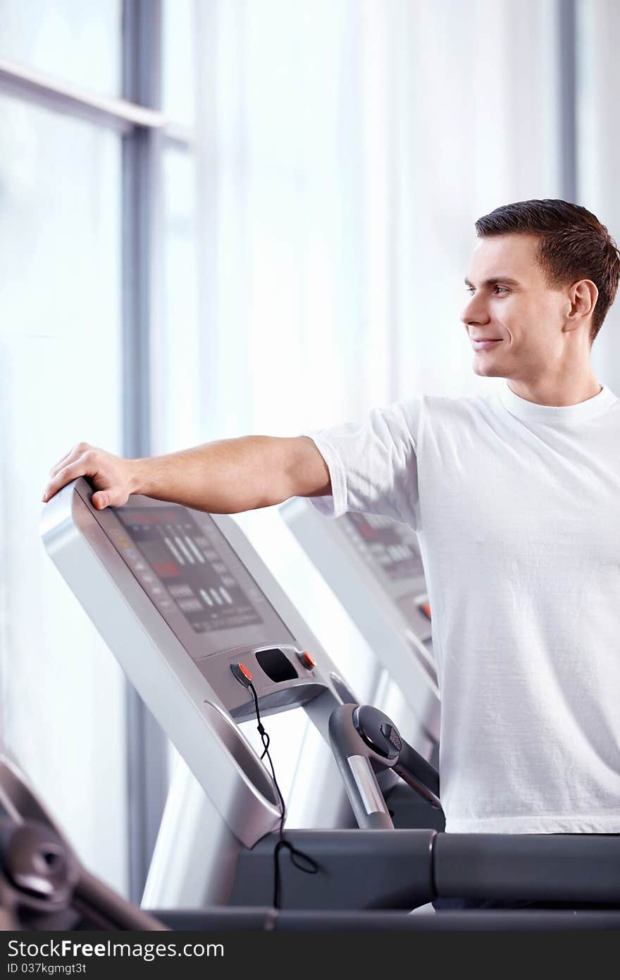 A young man in a fitness club. A young man in a fitness club