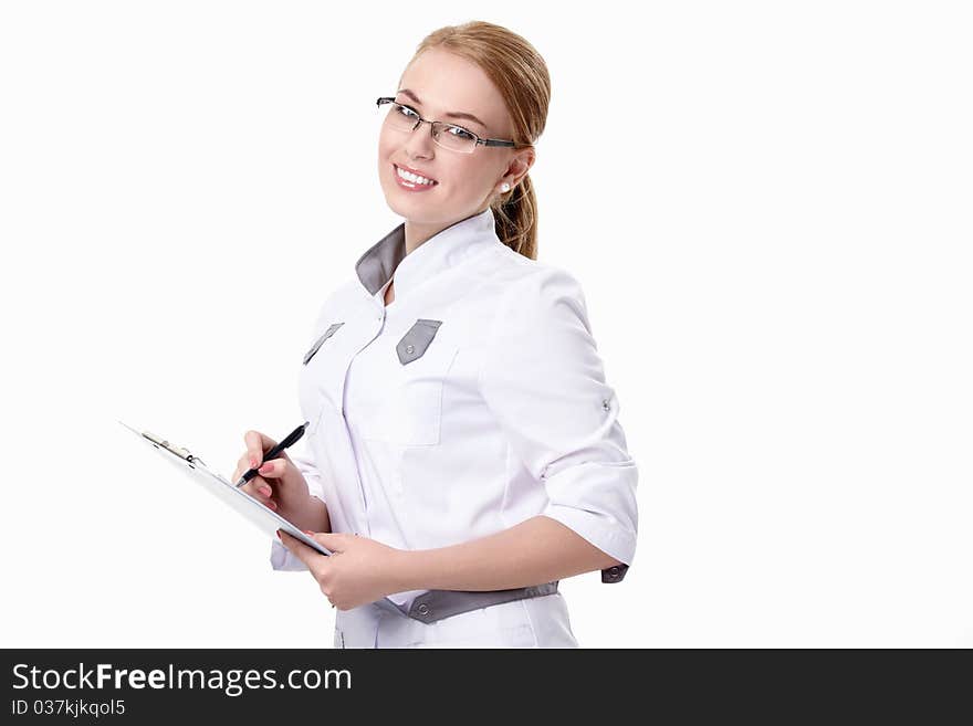 A smiling young woman doctor with a white background. A smiling young woman doctor with a white background