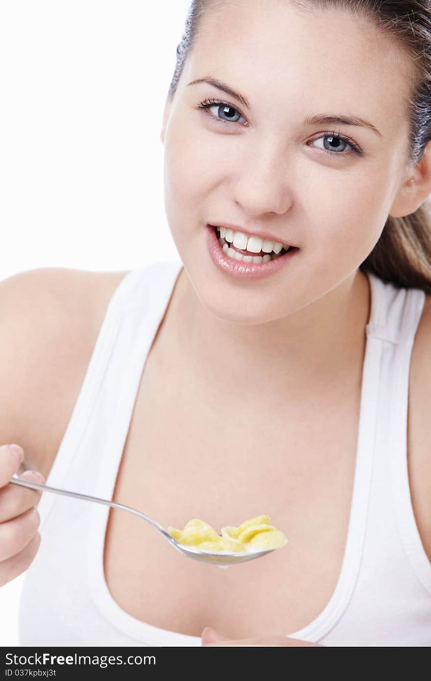 Attractive young girl with corn flakes. Attractive young girl with corn flakes