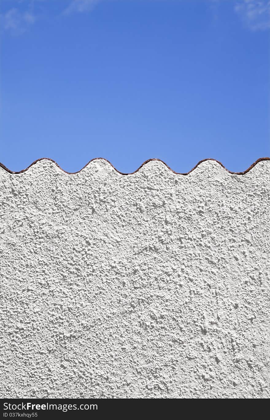 Mediterranean background . White wall against blue sky. Mediterranean background . White wall against blue sky.