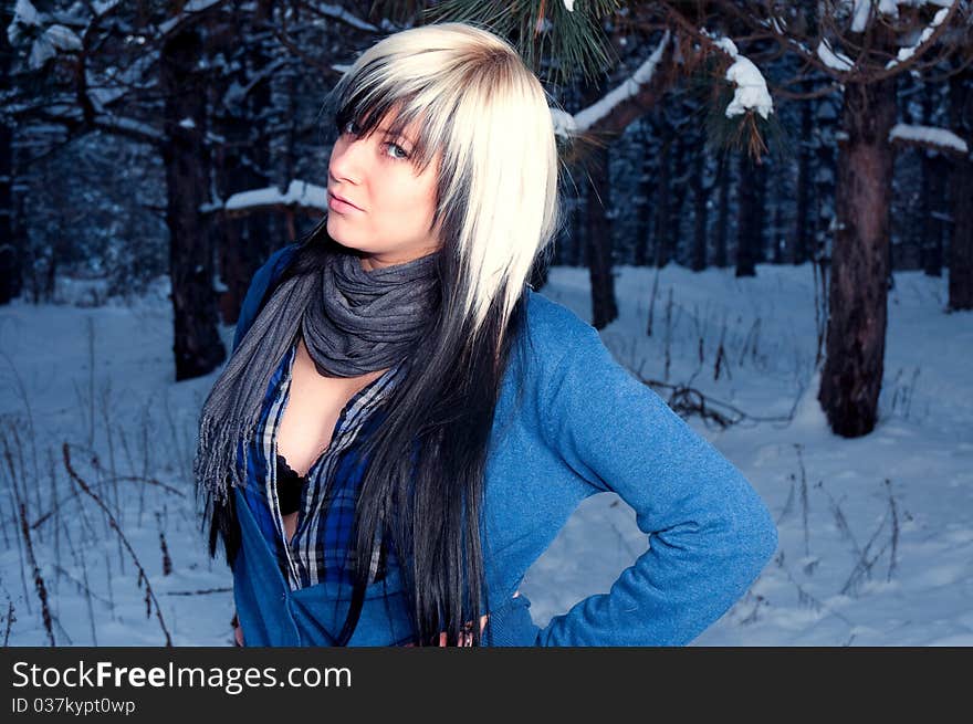 Beautiful girl in spruce forest