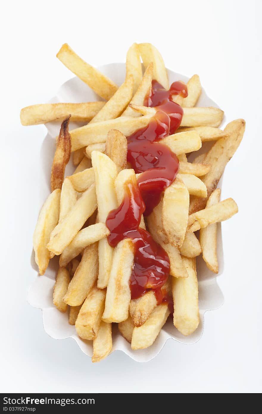 French fries and ketchup on a white background. French fries and ketchup on a white background