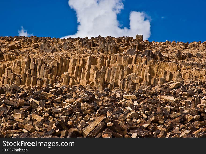 A unique crystal rock formation in the desert show the geomatrical shapes of ancient rock crystalization. A unique crystal rock formation in the desert show the geomatrical shapes of ancient rock crystalization