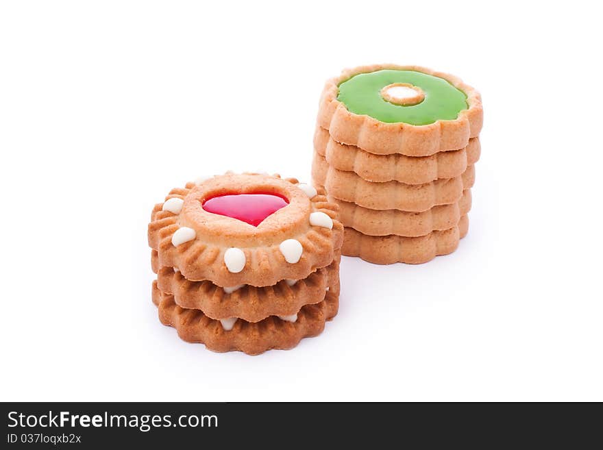 Close up shot of red and green cookies isolated on white