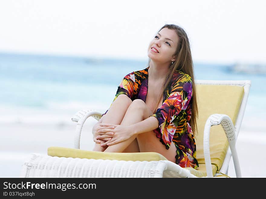 Attractive woman meidtating on sea background