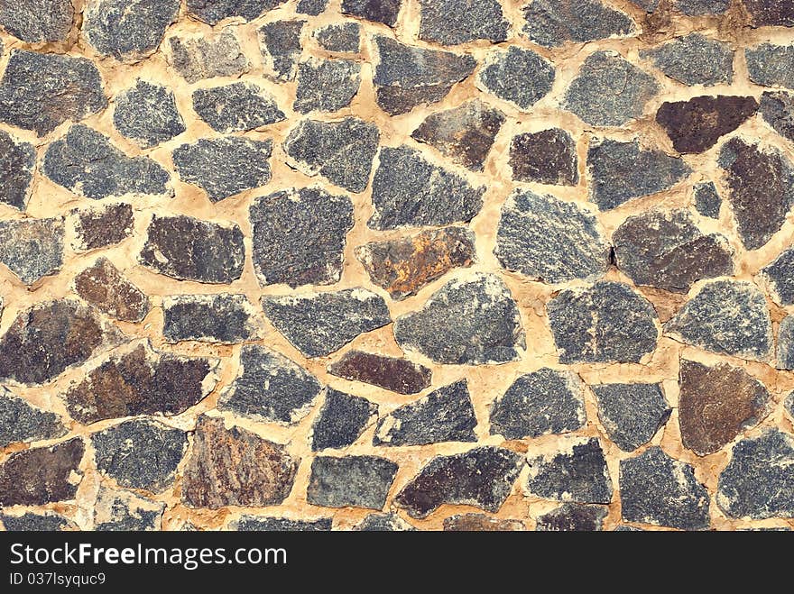 Old beautiful stone wall background. Old beautiful stone wall background