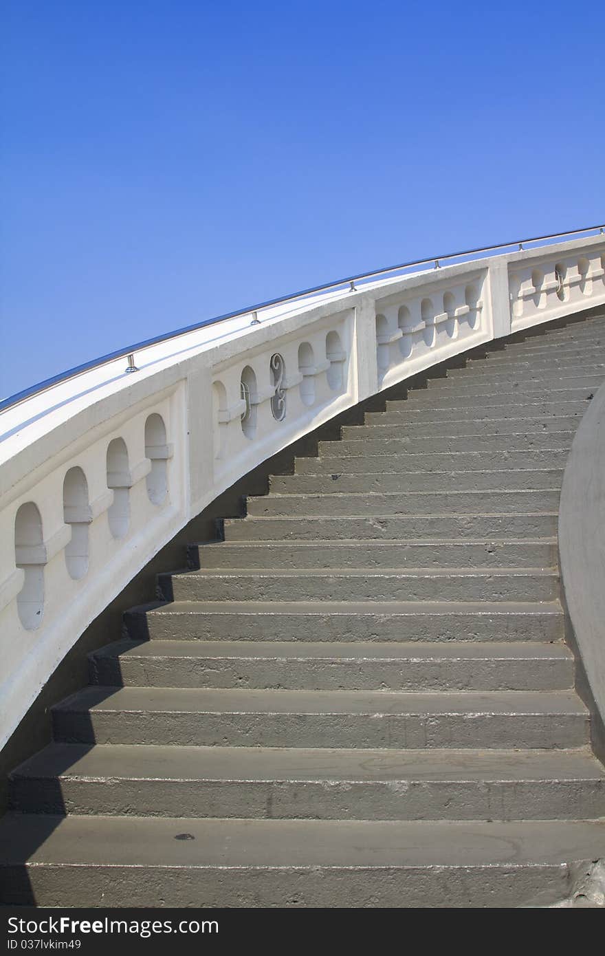 Old white stone circular stairs case