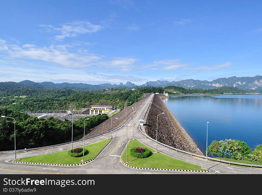 Road on electric dam with blue sky.