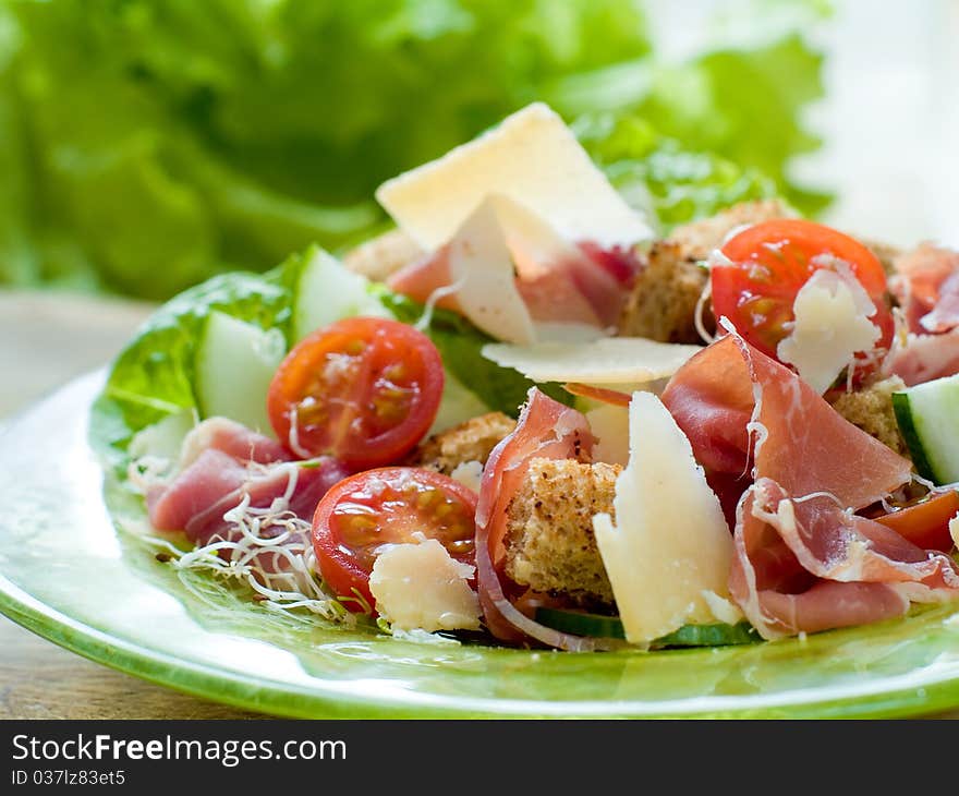 Fresh salad from vegetables, cheese and ham