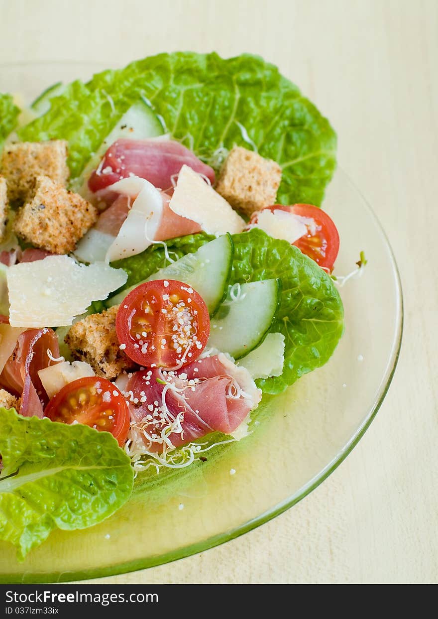 Fresh salad from vegetables, cheese and ham