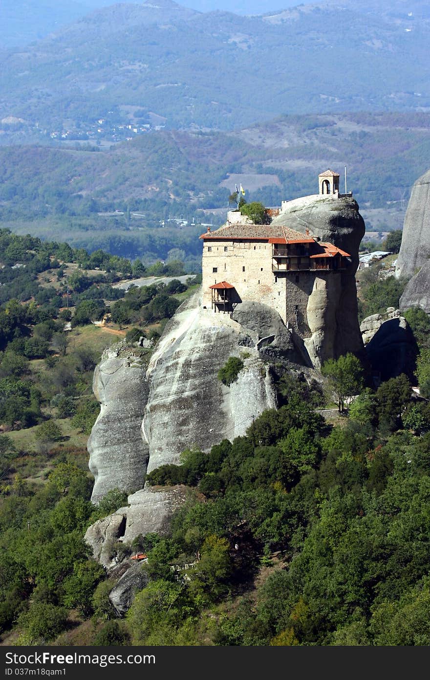 A monastary built into the cliffs in the ancient Meteora in Greece. A monastary built into the cliffs in the ancient Meteora in Greece.