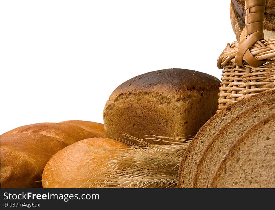 Bakery products and basket isolated on white