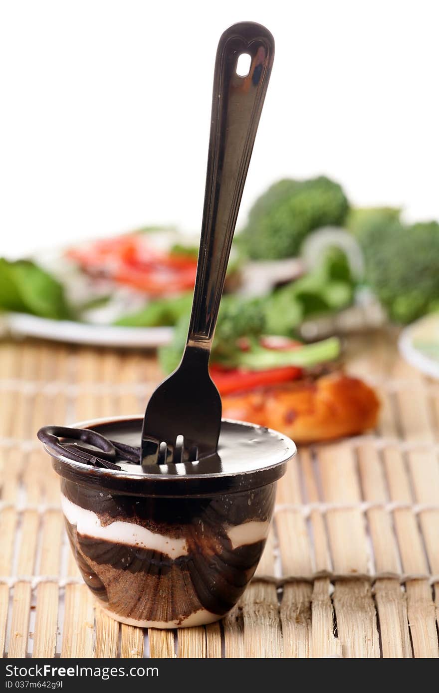 Chocolate pudding looking yummy over wooden background. Chocolate pudding looking yummy over wooden background.