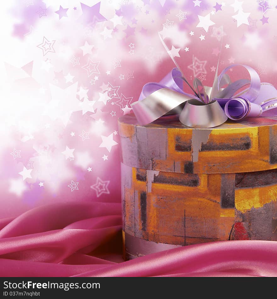 Box with a gift on a pink background