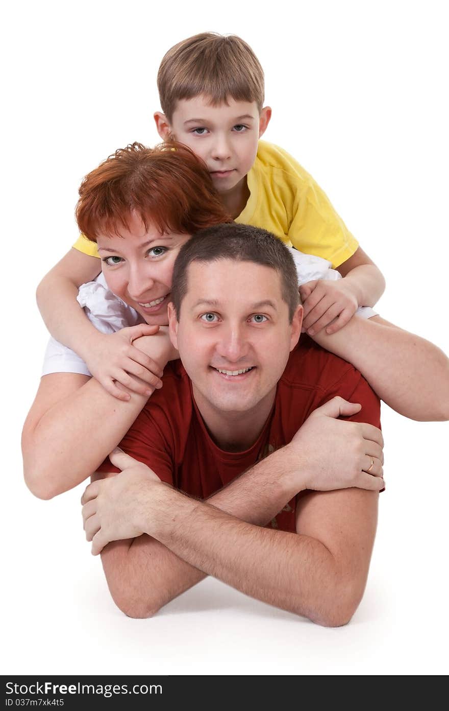 Mom and Dad and son lying on a white background