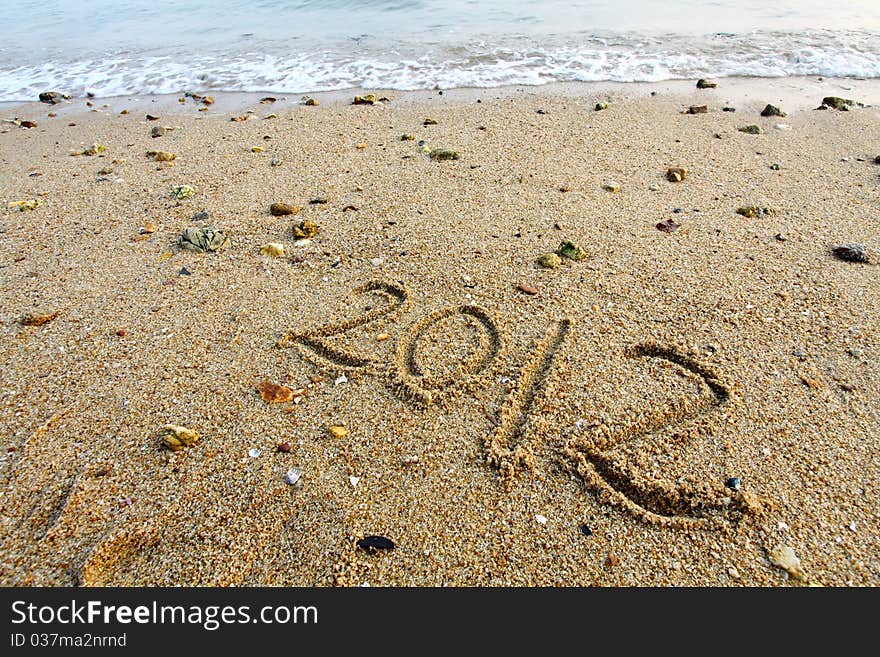 Hand written 2012 on a beach of Hong Kong. Hand written 2012 on a beach of Hong Kong.