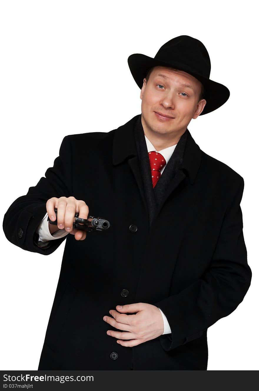 Man in a black coat and hat with a gun on a white background