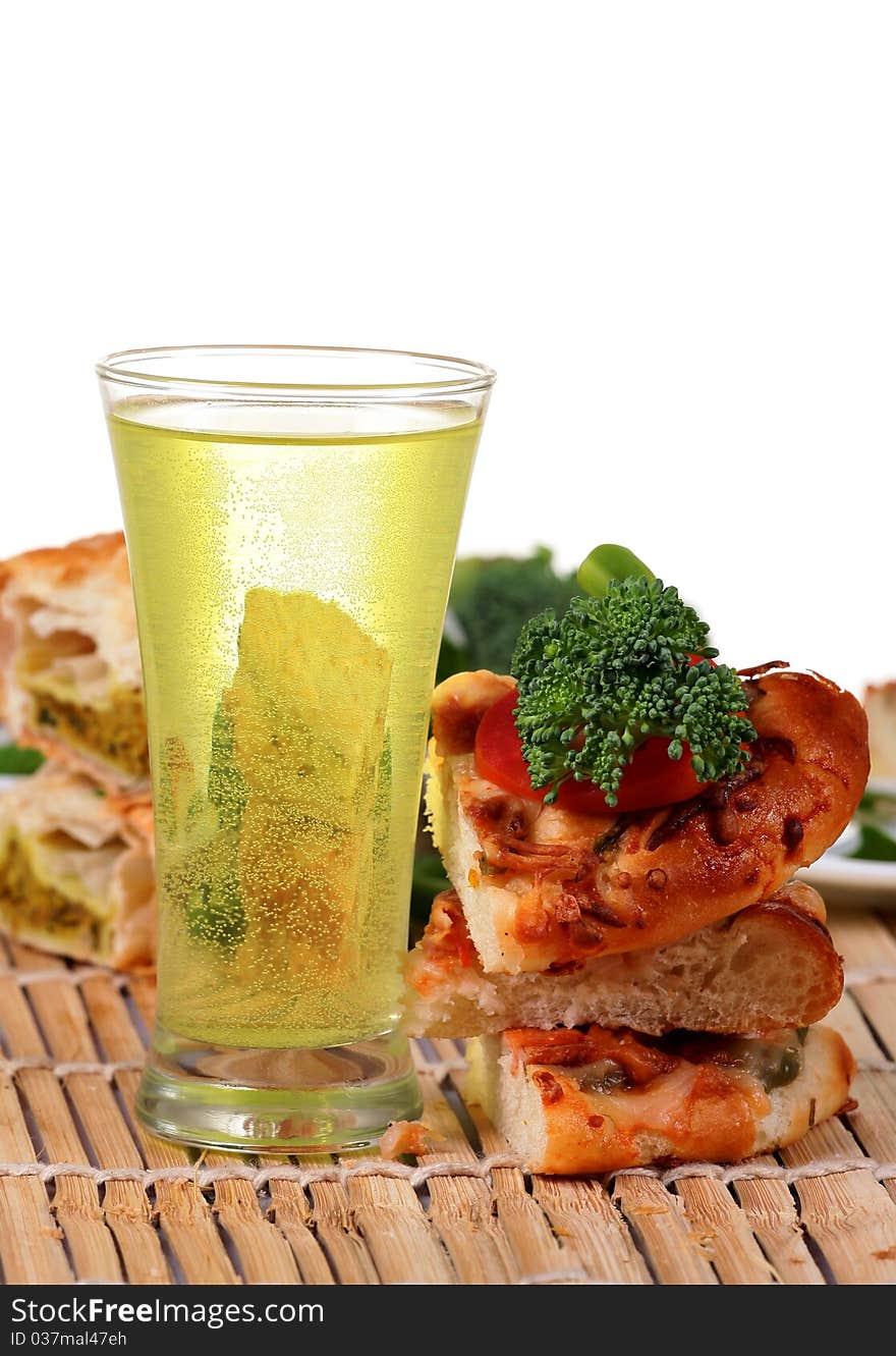 Pizza slices with carbonated water over wooden background. Pizza slices with carbonated water over wooden background.