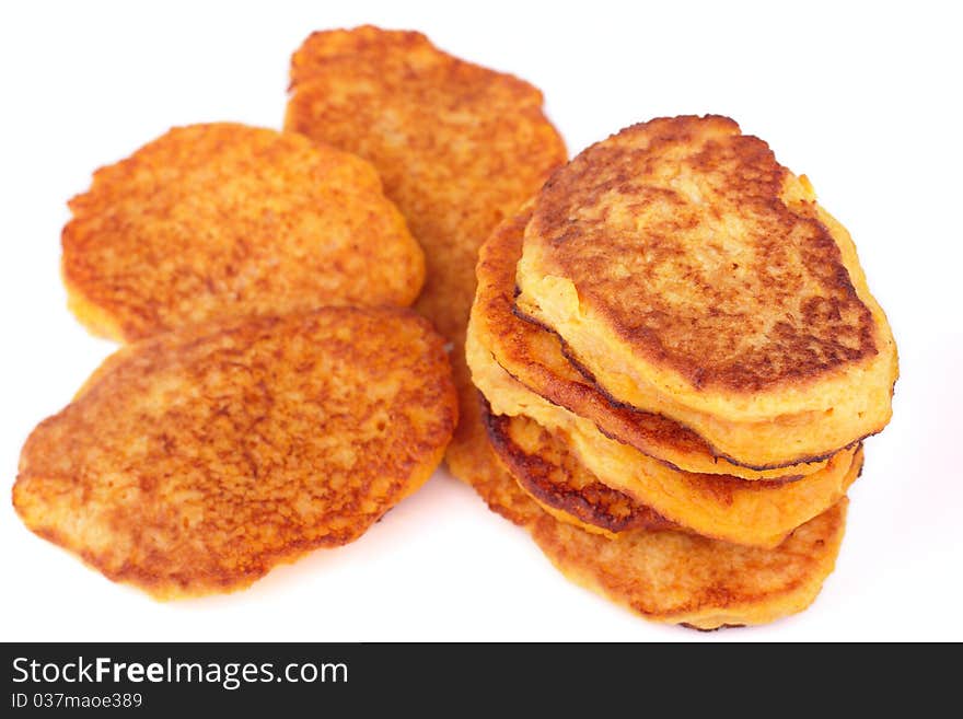 Fresh homemade fried pumpkin pancakes for breakfast isolated on white background