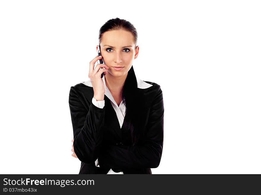 Serious buisnesswoman talks on the phone. Isolated on white background. Serious buisnesswoman talks on the phone. Isolated on white background