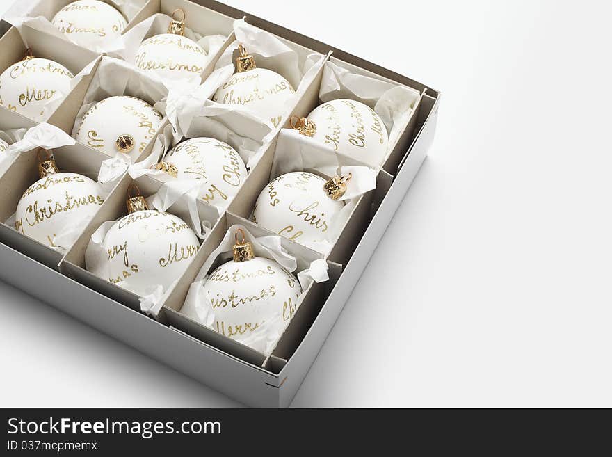 Close-up of White Christmas balls in box