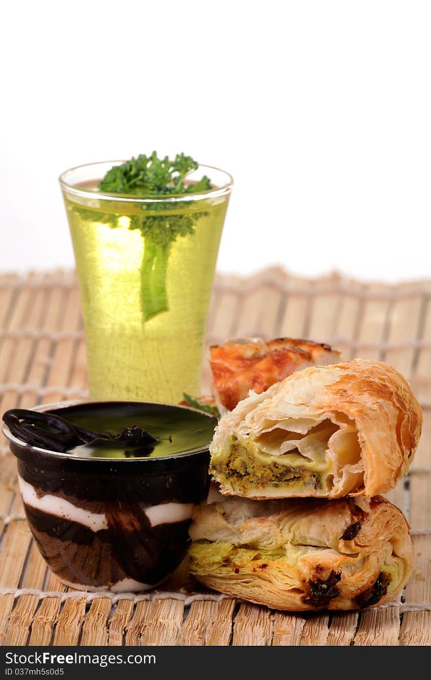 Chocolate pudding with danish pastry over wooden background. Chocolate pudding with danish pastry over wooden background.