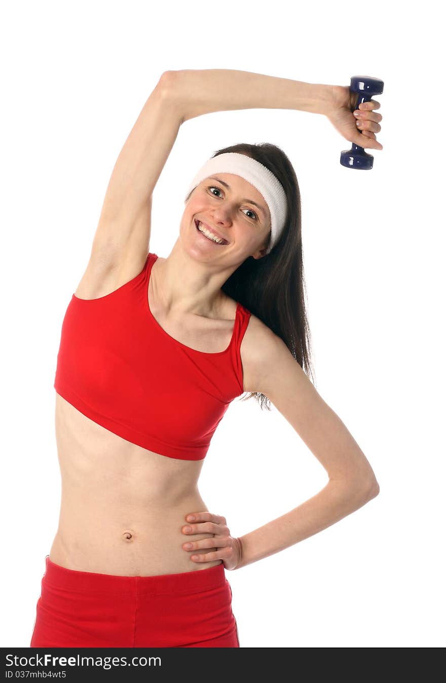 Happy young woman exercising with a dumbbell