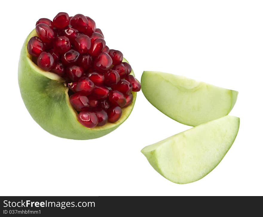 Grains of pomegranate are in an apple two lobules of apple lie alongside